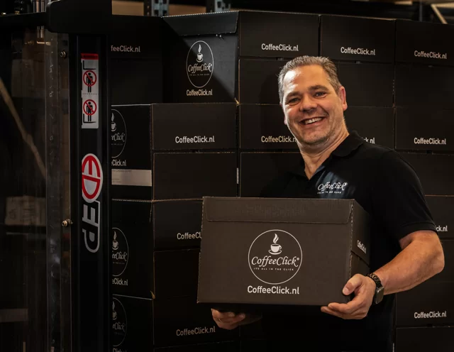 Robert, a team member, is on his way to deliver coffee to businesses